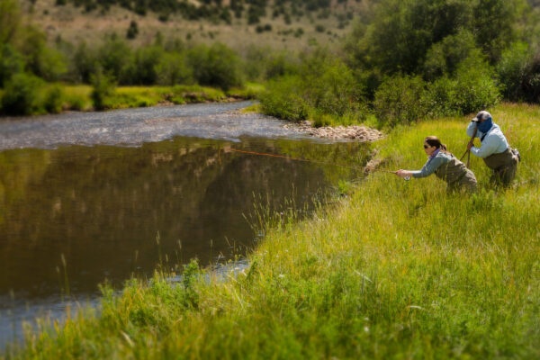 Jaimie Mercer of Orvis casts to rising trout with Falcon's Ledge guide Grant Bench